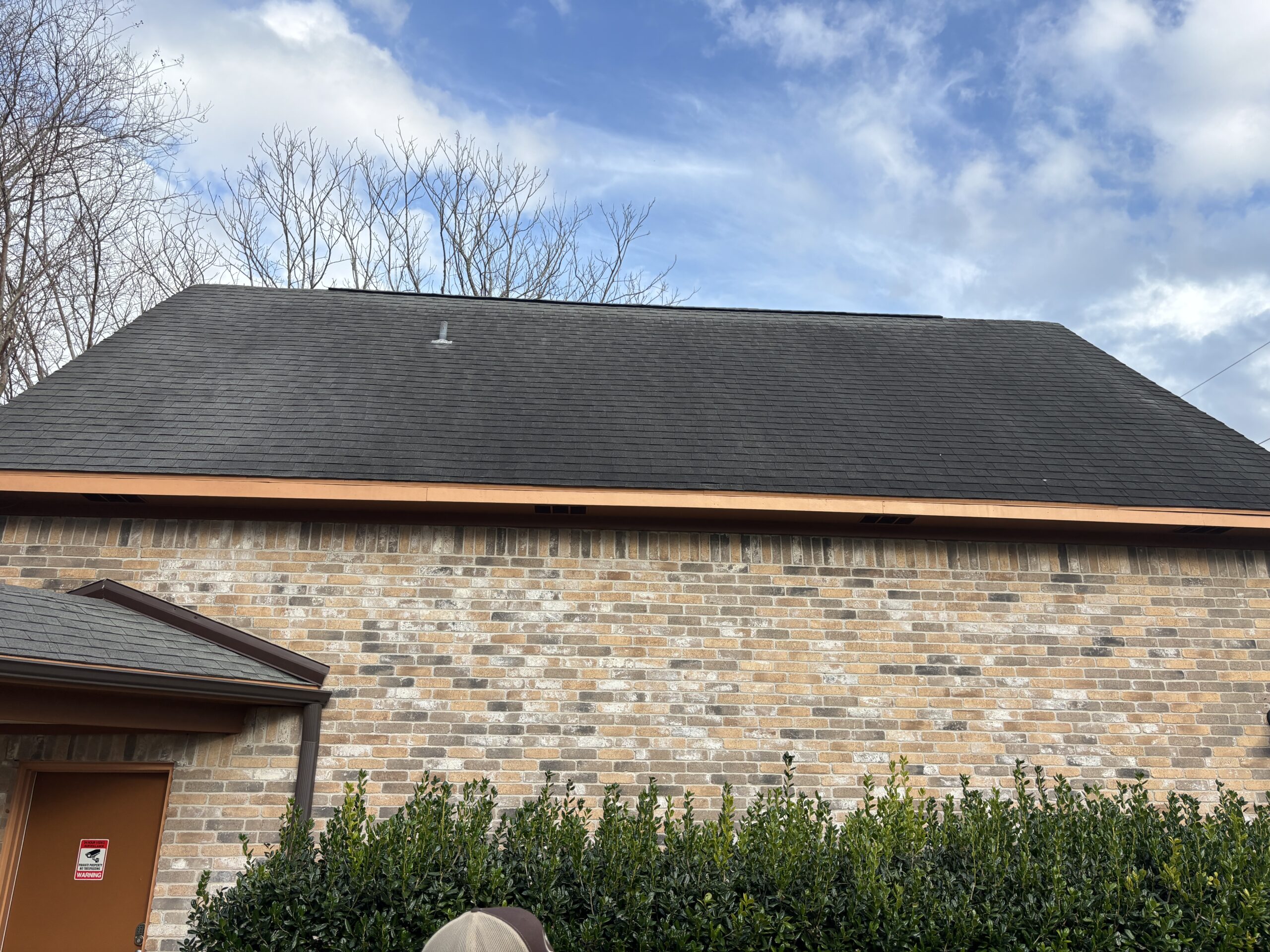 Storm damaged shingles on a residential roof